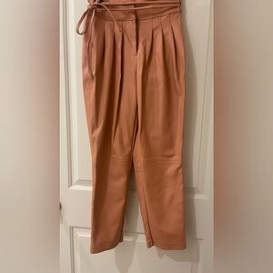 Faux leather pleated trousers. Nice pink color.